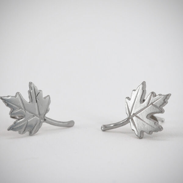 These are sterling silver (.925 silver) maple leaf stud earrings.